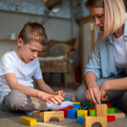 Mum and son playing with building blocks