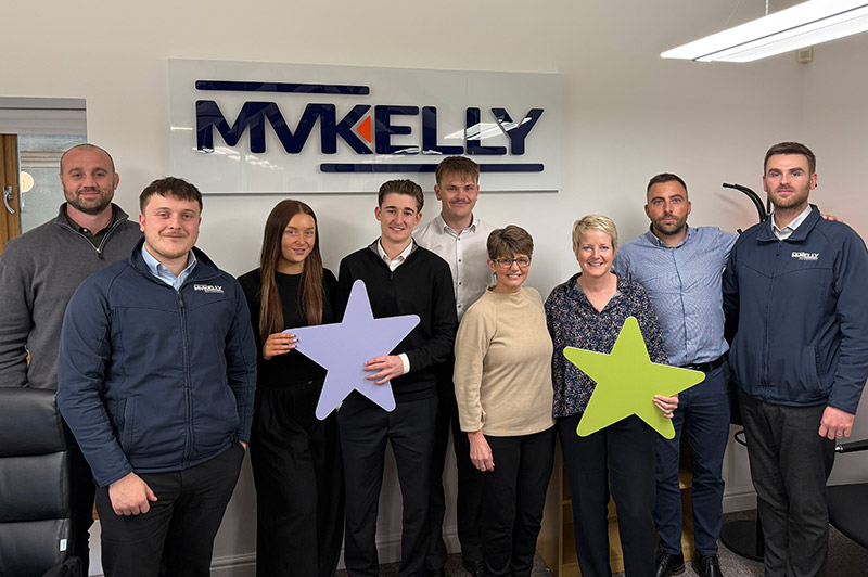 MM Kelly Staff group photo holding SeeSaw stars