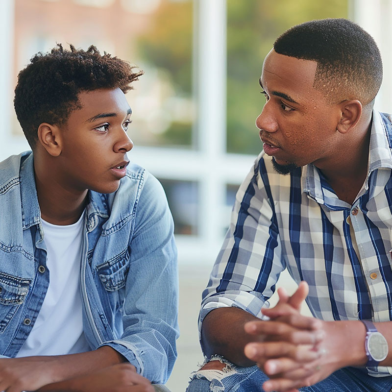 Father talking to his teenage son